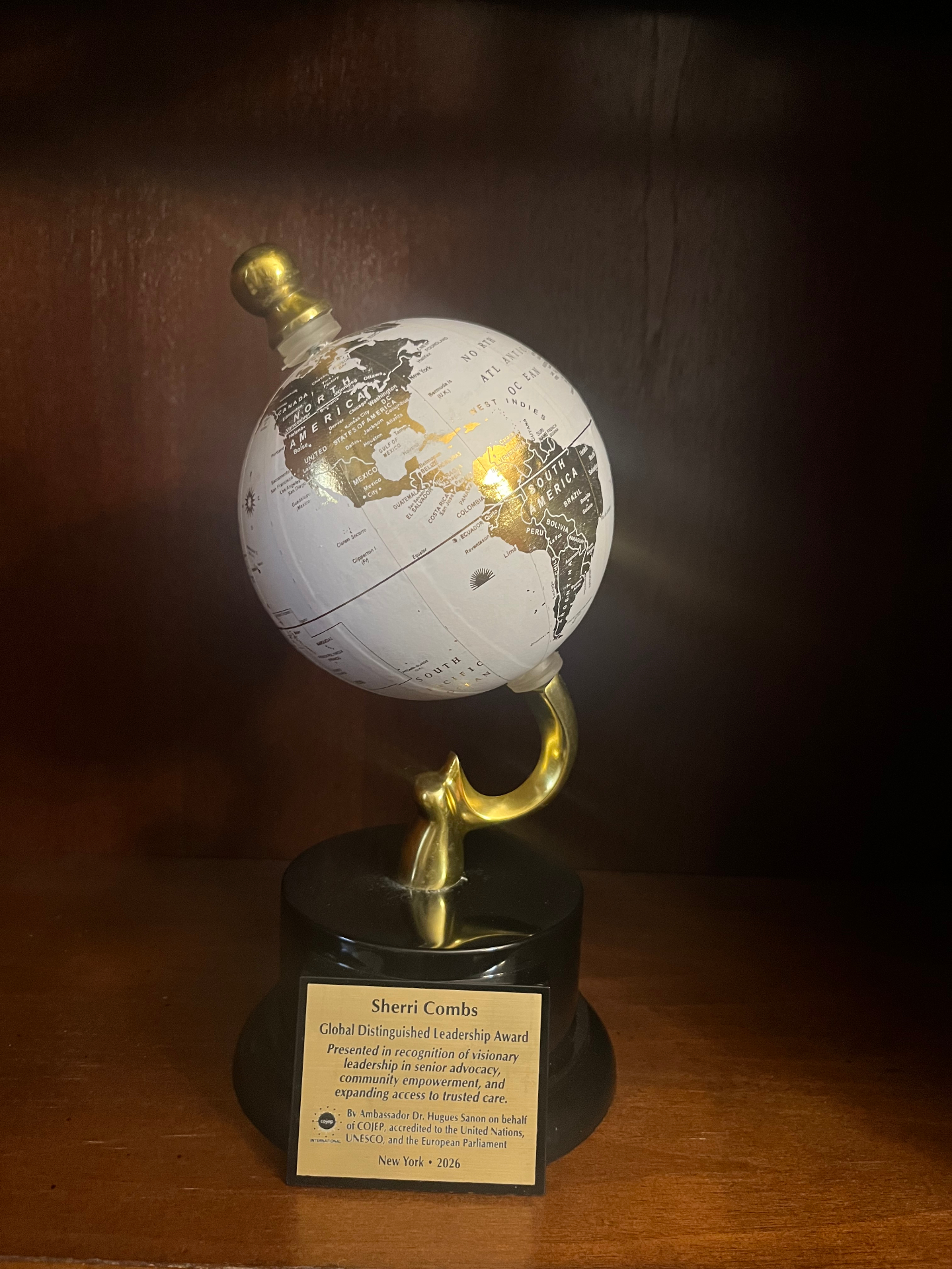 Global Distinguished Leadership Award trophy presented to Sherri Combs